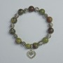 Brățară din jasper «Sânge de dragon» cu mărgele netede, diametrele de 10,5 mm și 8 mm, însirate pe un șir elastic, lungime 18 cm +/- cu inserții metalice