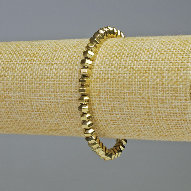 Brățară din hematit tăiat în rondelle, culoare aurie, diametrul 6×4 mm, lungime 18 cm, pe elastic