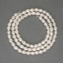 Perle de râu albe pe fir, diametrul 4–4,5×4 mm, +/- pe fir, lungime 37 cm+