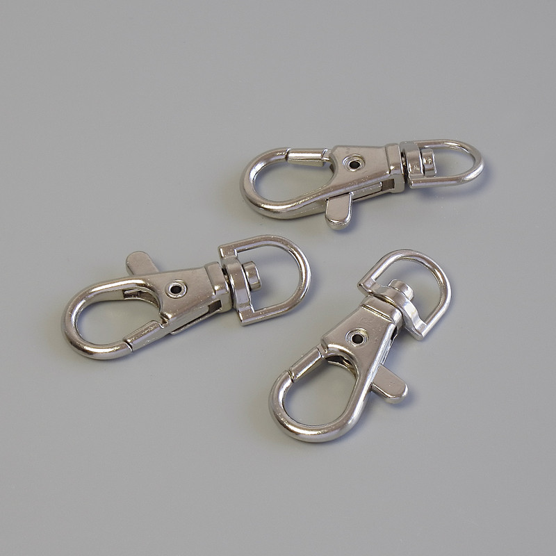 Prețul per pachet / 10 bucăți. Închizătoare carabină, diametrul 37×16 mm, culoare metalică argintie