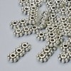 Mărgea separator pentru 3 fire, diametrul 15×6, 5 mm +/-, diametrul găurii 2 mm, culoare argintie a metalului, 22 buc.