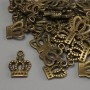 Pandantiv Coroană, culoare bronz, dimensiuni 15×10×1 mm, gaură Ø 2 mm, ambalaj 20 g (~36 buc.)