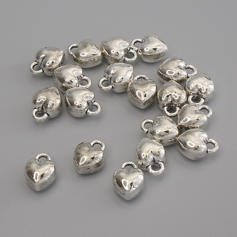 Pandantiv inimă, culoare argintie metal, diametrul 9×7 mm, ambalaj 18 buc.