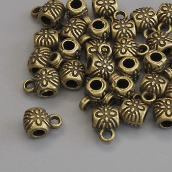 Furnitură bail, culoare bronz, dimensiuni 8,5×6 mm, +/- găuri; diametru 2,8 mm, +/-; diametru 1,8 mm, +/-; ambalaj 20 g (~28 buc.)