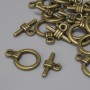 Închizătoare toggle, cerc de 15x3 mm ±, diametru 9,5 mm ±, diametrul găurii 7 mm ±, culoare metal bronz satinat, 15 buc.