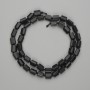 Mărgele din șungit, tăiate cu fațete 7–8×5–6 mm, lungime aproximativă 40 cm, pe șnur