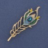 Broșă în formă de pană, email și strasuri, metal auriu, 72×24 mm +