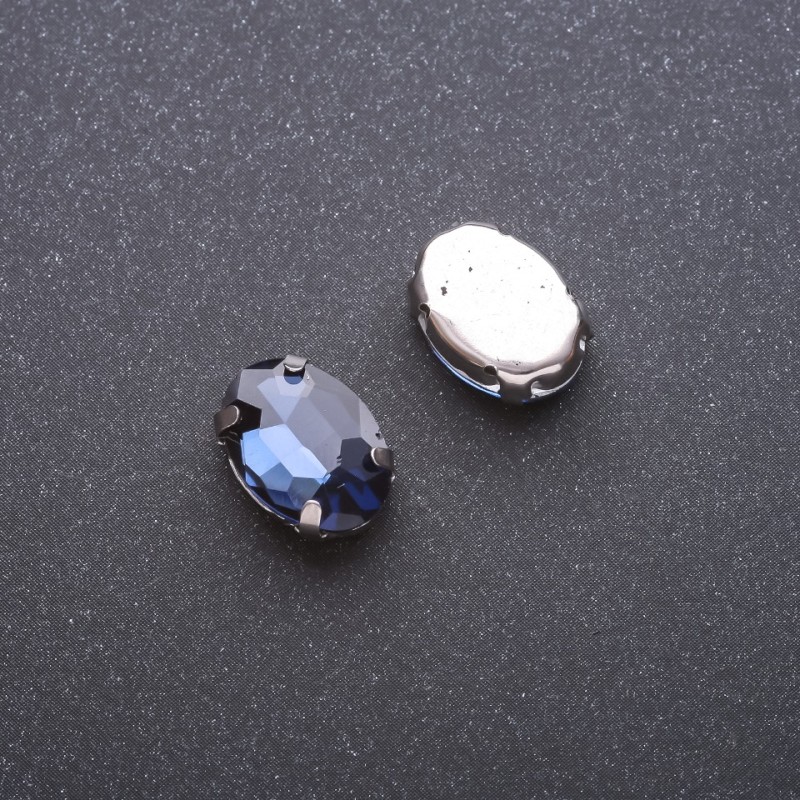 Preț per pachet /10 bucăți. Cristal cusut în țapă oval 10×14 mm, albastru