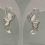 Cercei cu știfturi «Aripile fluturelui» în cristale / inserție «ochi de pisică» cristal / metal argintiu / 30×20 mm