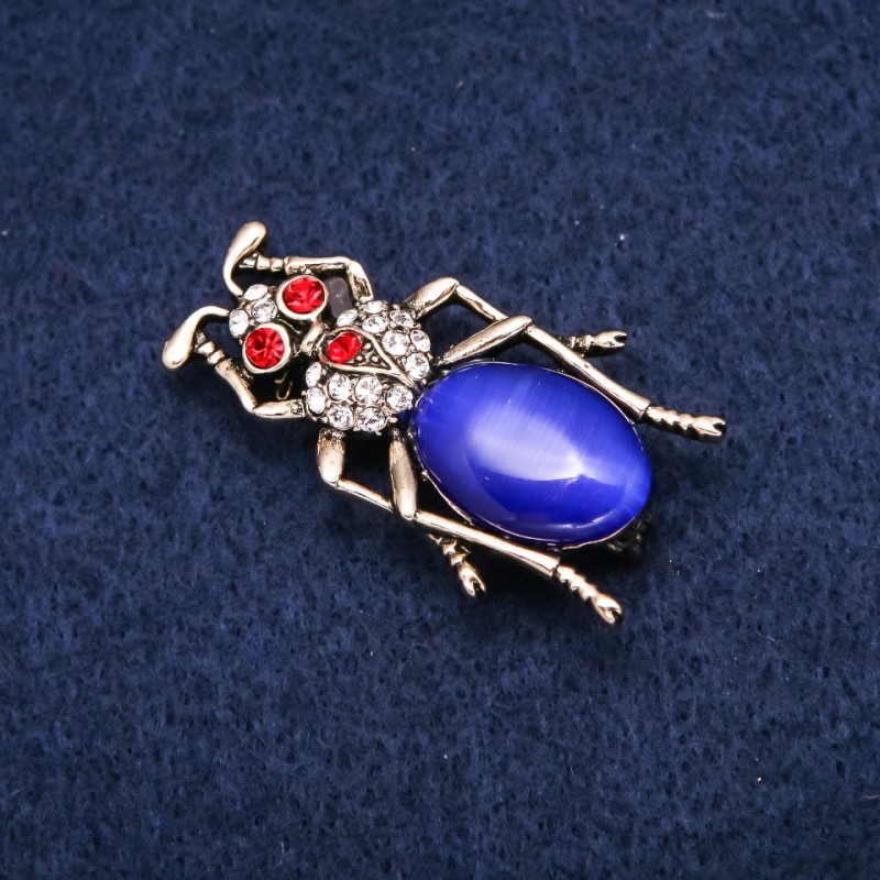 Broșă Gândac cu cabochon ochi de pisică și strasuri, metal auriu, 23x40 mm