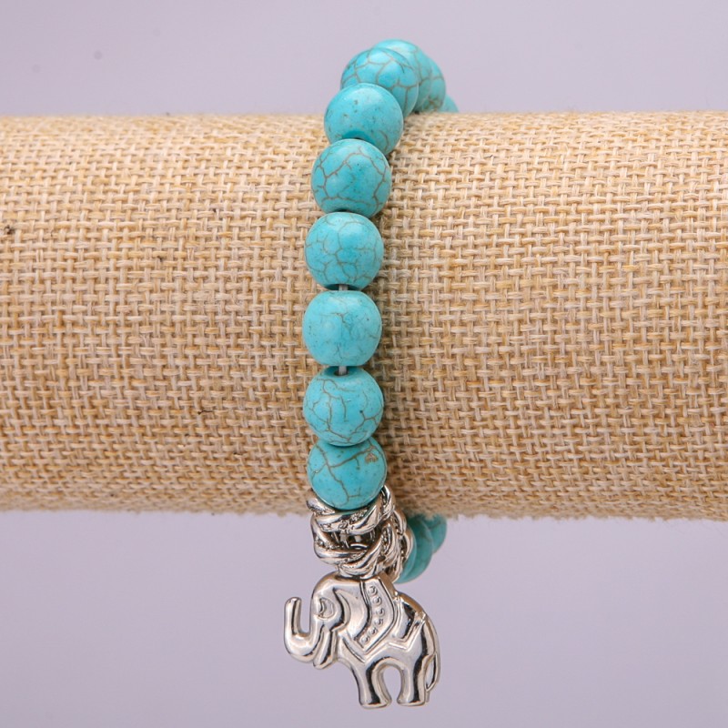 Brățară din turcoaz pe elastic, diametrul 10 mm (±), lungimea 18 cm, cu inserții și pandantiv în formă de elefant