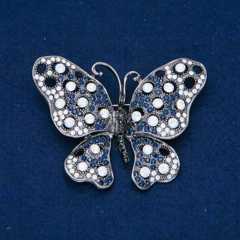 Broșă Fluture, metal argintiu, cu strasuri negre, albastre și albe, 50x66 mm +