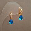 Cercei Xuping placare cu aur 18K, cu strasuri albe și cristal albastru, diametrul 20x6 mm +