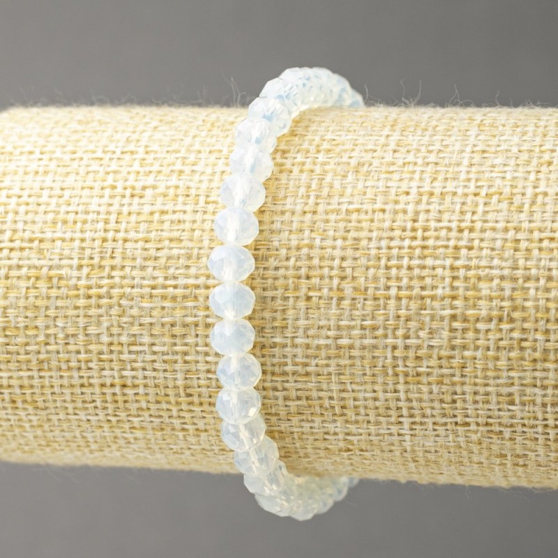 Brățară elastică din opalit sintetic – sticlă cehă milky-transparentă, rondele tăiate, diametrul 6×4,5 mm +