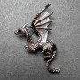 Broșă Dragon, bronz mat și email negru, metal argintiu 42×66 mm