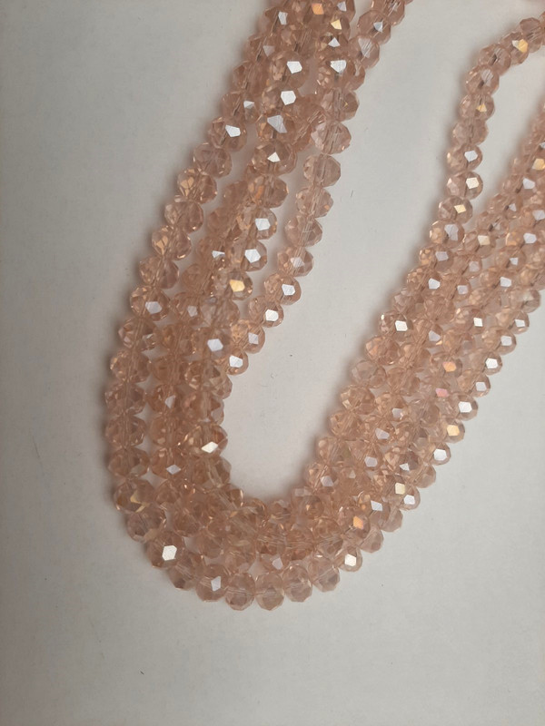 Mărgele din cristal cehesc roz deschis, fațetate, nuanță de «benzină», diametru 8x6 mm, lungime 39 mm +/- pe fir