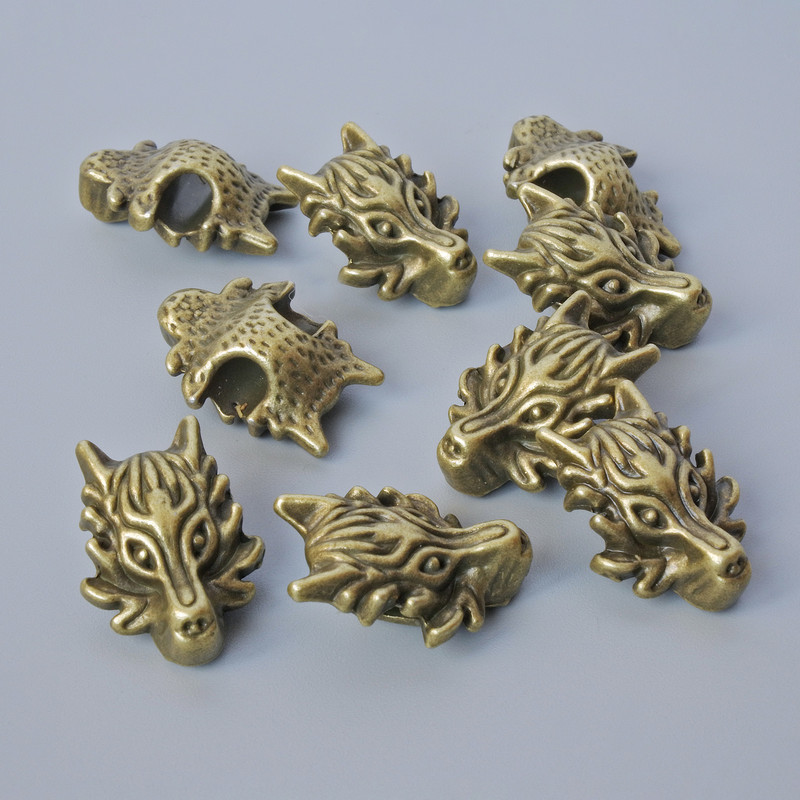 Inserție pentru mărgele «Dragon», dimensiuni 18×13×8 mm, diametrul orificiului 3,7 mm, set de 9 bucăți ± culoare bronz metalic