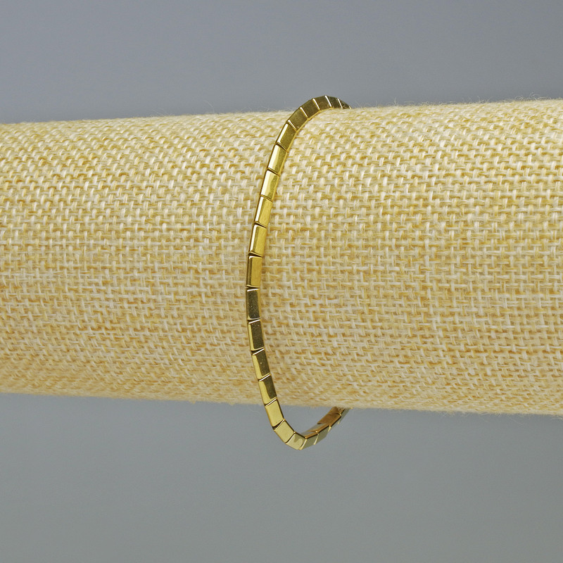 Brățară din hematit în formă de triunghiuri, culoare aurie, diametru 5x2 mm, lungime 18 cm, bandă elastică