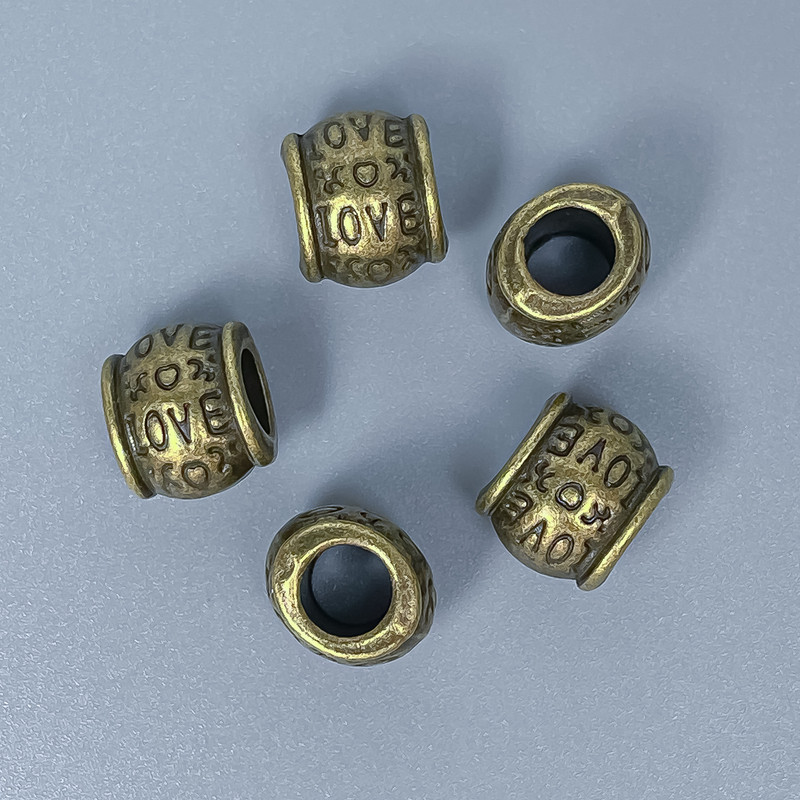 Furnitură – mărgea-inserație, culoare bronz metalic, diametrul 9×10 mm ±, gaură de aproximativ 5 mm ±, ambalaj 10 buc