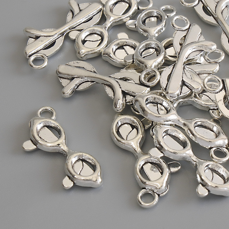 Pandantiv „Ochelari” culoare metal argintiu, diametru 23×9 mm, ambalare 15 buc