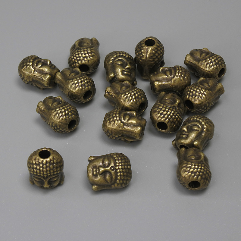 Mărgea-inserație Buddha, culoare bronz metalic, diametru 9×7 mm ± gaură 2,4 mm ± ambalare 16 buc.