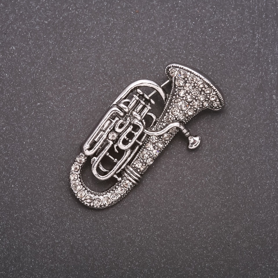 Брошка Труба в стразах сірий метал 47х25мм