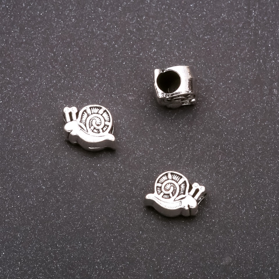 Inserție Pandora Melc, diametru 11x9 mm, diametru interior 4 mm, ambalaj 20 g ± 11 buc