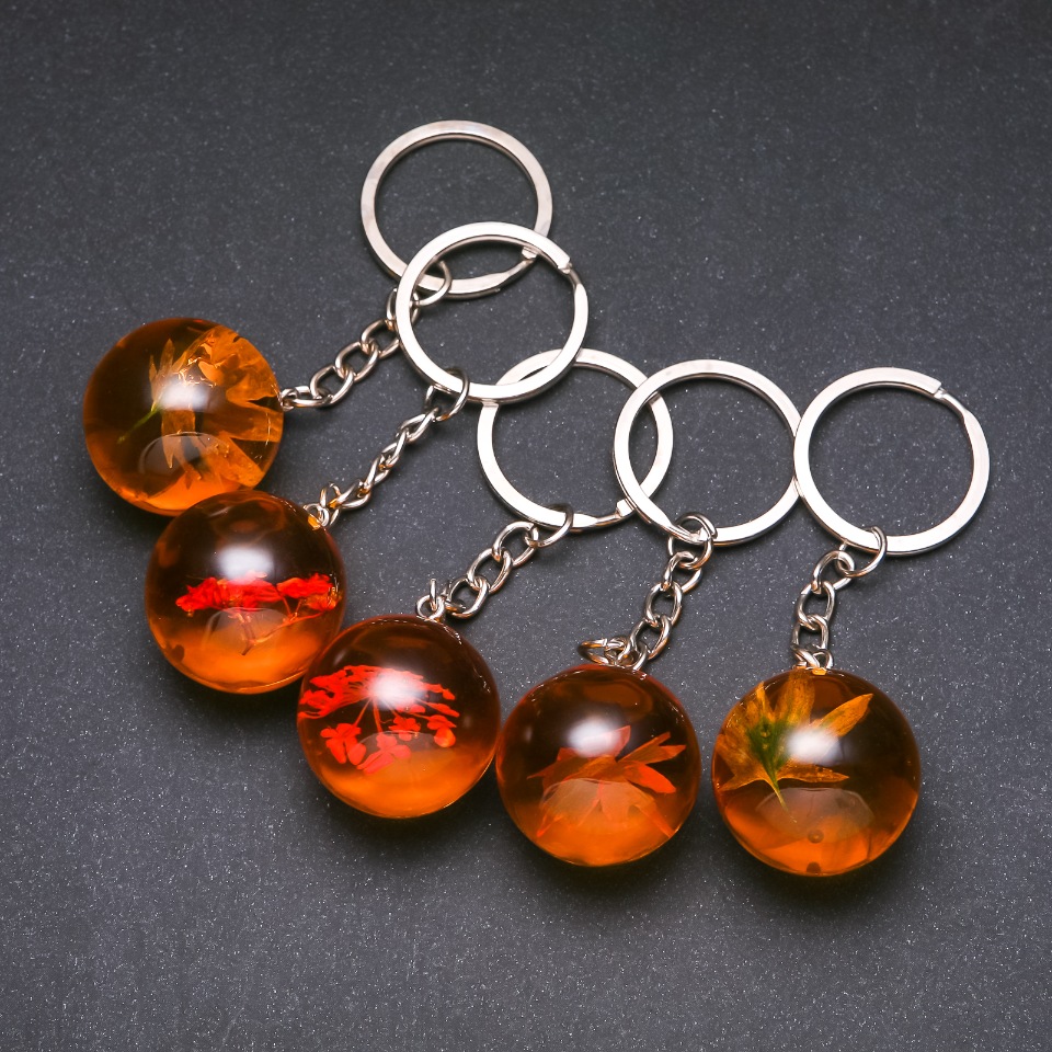 Breloc cu flori în rășină, asortate, lungime 9 cm (preț pentru 1 bucată)