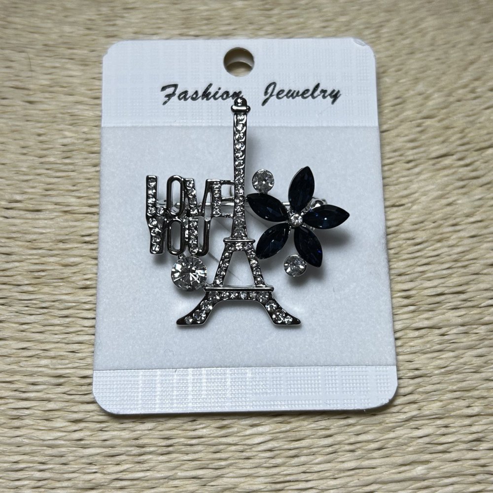 Broșă Paris metal argintiu, strasuri și cristale albastre 40x35mm +